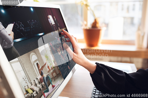 Image of Woman choosing what to watch at home during insulation, COVID-19 quarantine