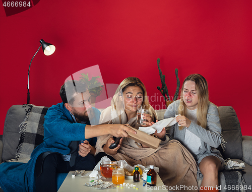 Image of Ill young people, friends or family with fever and cold look suffering at home