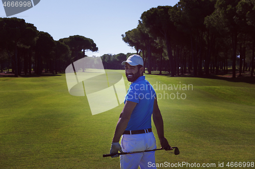 Image of golf player portrait from back