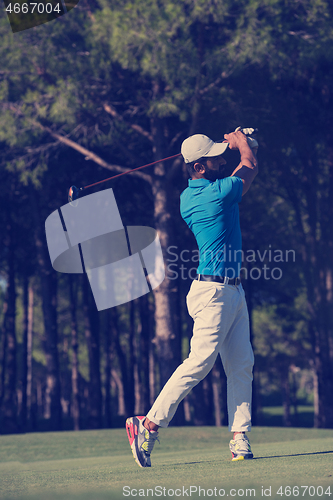 Image of golf player hitting long shot