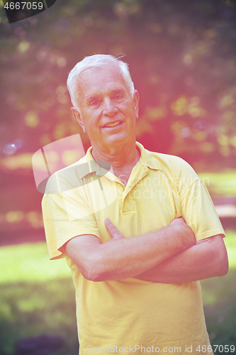 Image of happy grandfather and child in park