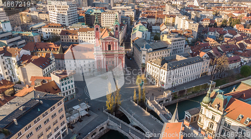 Image of Aerial drone view of Preseren Squere and Triple Bridge over Ljubljanica river,Tromostovje, Ljubljana, Slovenia. Empty streets during corona virus pandemic social distancing measures