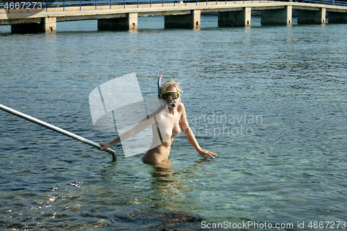 Image of Naked woman on the nudist beach