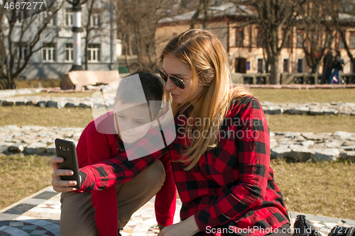 Image of Mother and son making selfie