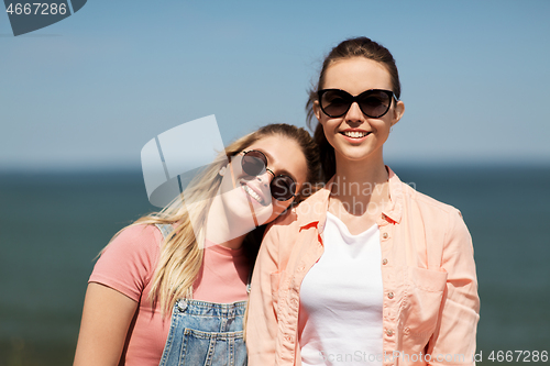 Image of teenage girls or best friends at seaside in summer