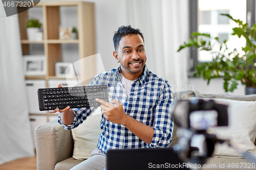 Image of male video blogger with keyboard videoblogging