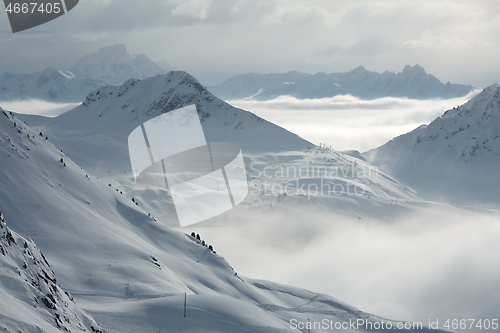 Image of Snowy skiing slopes from the top