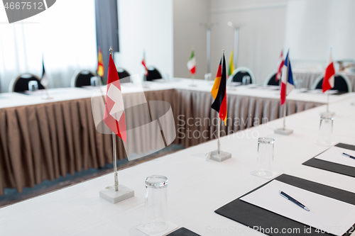 Image of table in boardroom at international conference