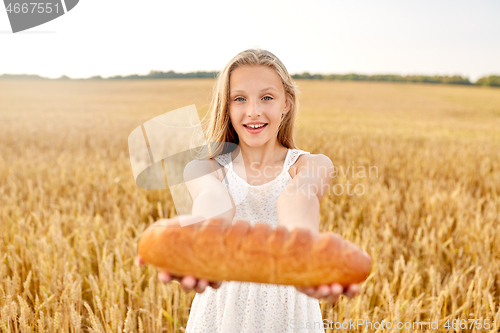 Image of girl with loaf of white bread on cereal field