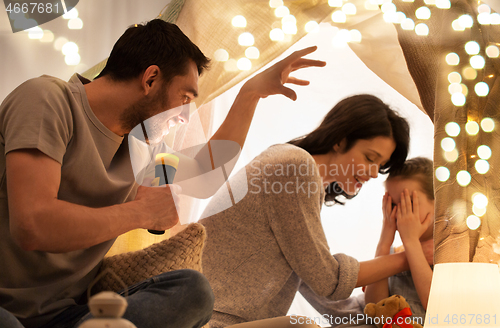 Image of father telling scary stories to his daughter