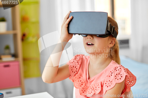 Image of girl in vr glasses at home