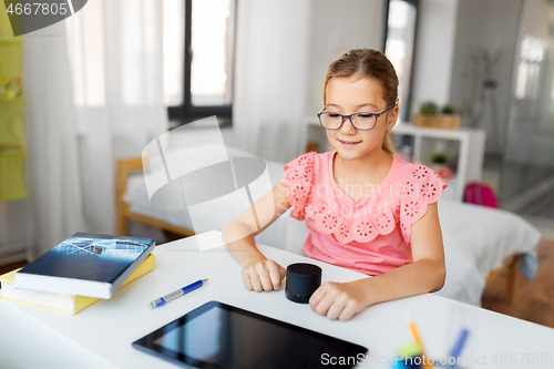 Image of student girl using smart speaker at home