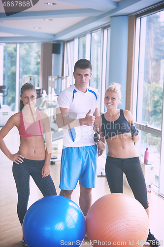 Image of people group in fitness gym