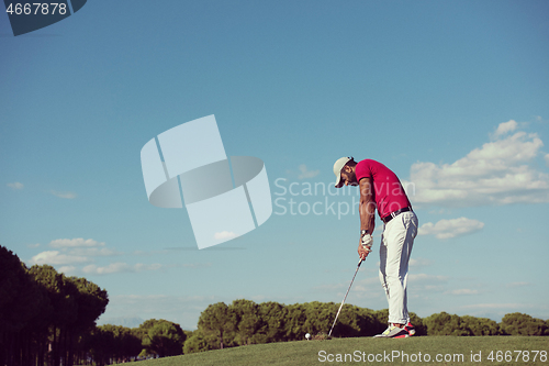 Image of golf player hitting long shot