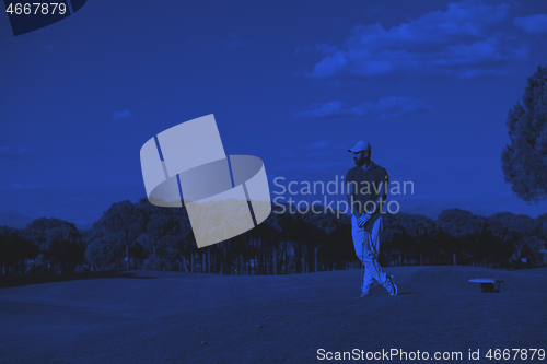 Image of handsome middle eastern golf player portrait at course