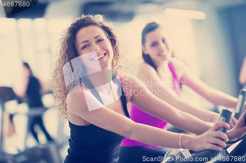 Image of Group of people running on treadmills