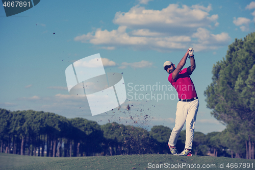 Image of golf player hitting long shot