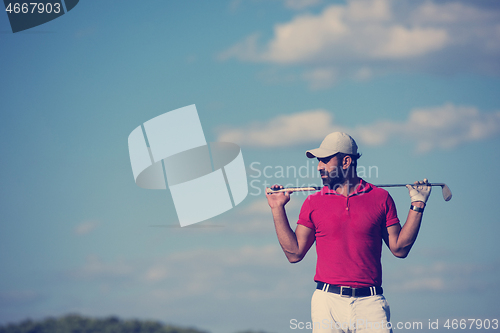 Image of handsome middle eastern golf player portrait at course