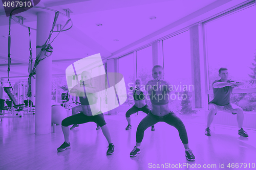 Image of group of  people working out in a fitness gym