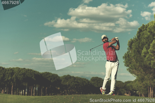 Image of golf player hitting long shot