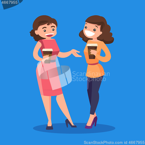 Image of Two caucasian white business women drinking coffee