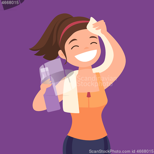 Image of Caucasian sportswoman wiping sweat with a towel.