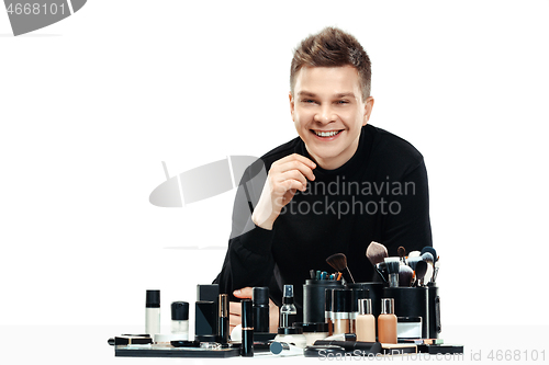Image of Professional makeup artist isolated on white