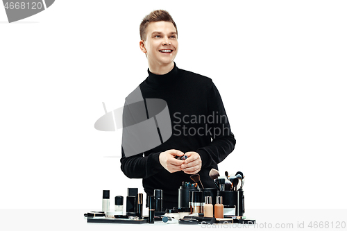 Image of Professional makeup artist isolated on white