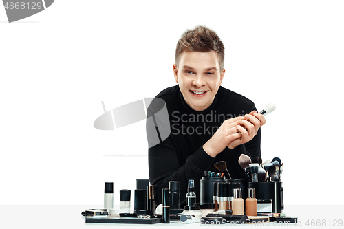 Image of Professional makeup artist isolated on white