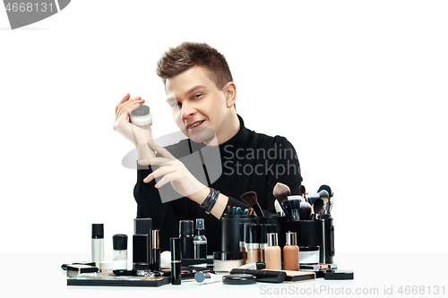 Image of Professional makeup artist isolated on white