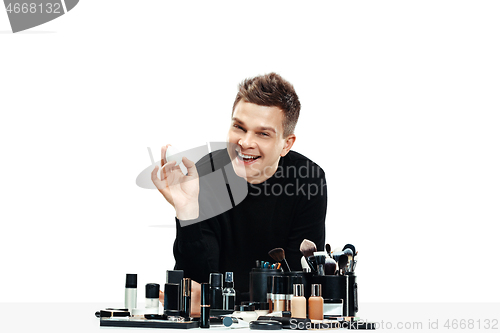 Image of Professional makeup artist isolated on white