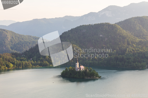 Image of Lake Bled, island with a church and the alps in the background, Slovenia