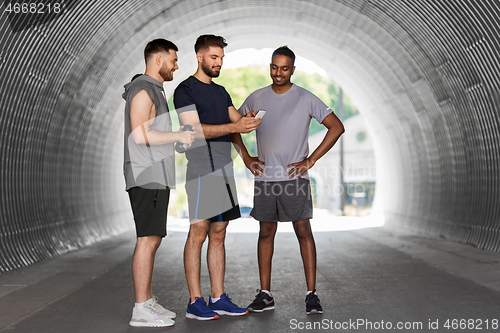 Image of sporty men or friends with smartphone outdoors