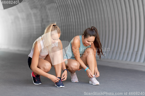 Image of women or female friends doing sports outdoors