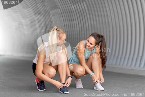 Image of women or female friends doing sports outdoors