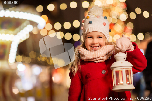 Image of happy little girl at christmas with lantern market