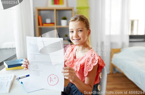 Image of student girl with school test good mark at home