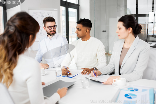 Image of recruiters having job interview with employee