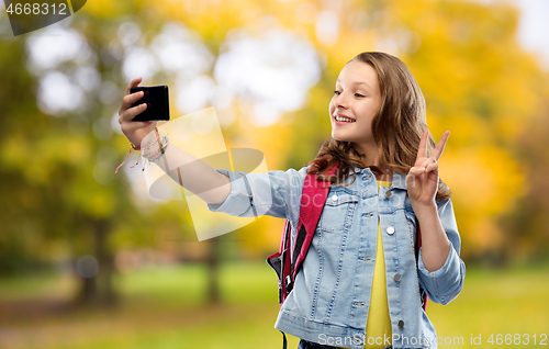 Image of teenage student girl taking selfie by smartphone