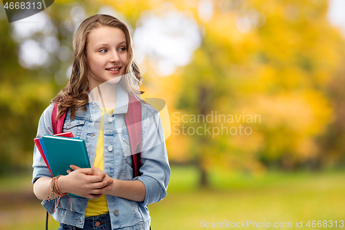 Image of happy smiling teenage student girl with school bag