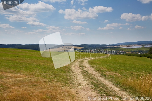 Image of Country dirt road through farmlands