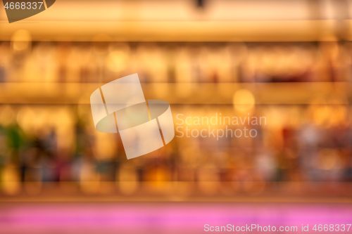 Image of Blurred creative background of restaurant bar with pink desk space.