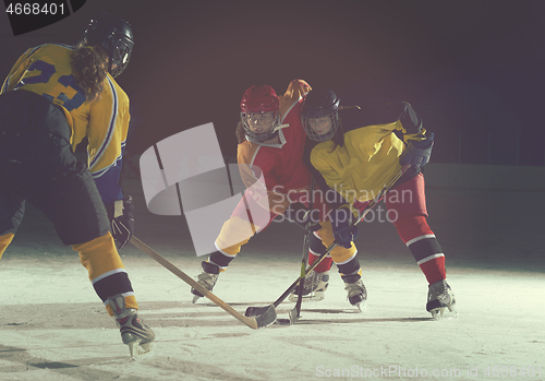 Image of teen ice hockey sport  players in action