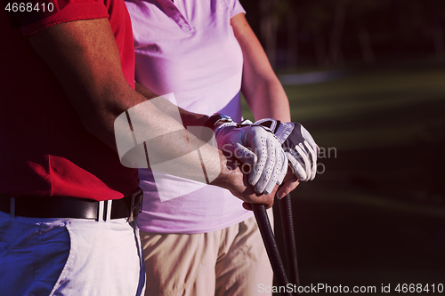 Image of portrait of couple on golf course