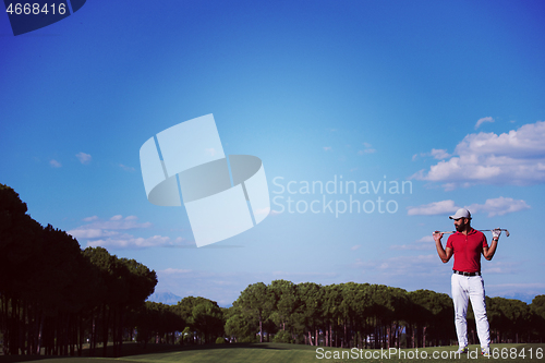 Image of handsome middle eastern golf player portrait at course