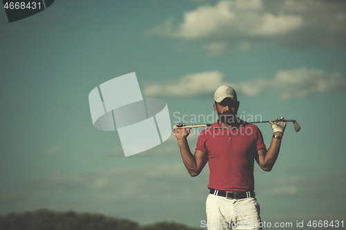 Image of handsome middle eastern golf player portrait at course