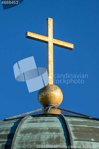 Image of golden cross on a roof