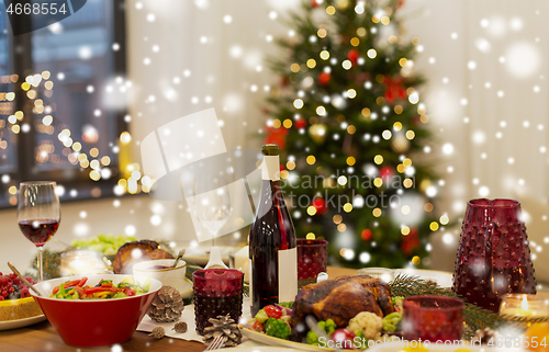 Image of food and drinks on christmas table at home