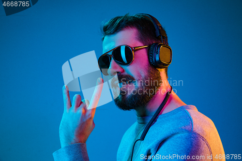 Image of Enjoying his favorite music.