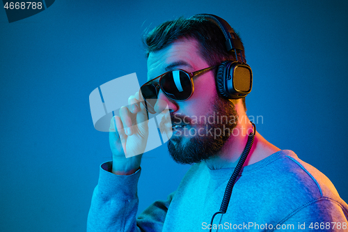 Image of Enjoying his favorite music.